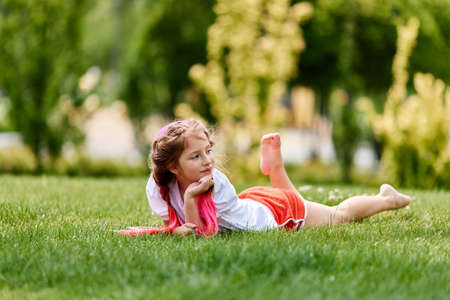 child girl with braided hair style with pink kanekalonの写真素材