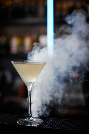 the exotic alcoholic cocktail with the smokeの写真素材