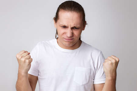 Emotions of a television fan. Screams, hatred, rage.の写真素材