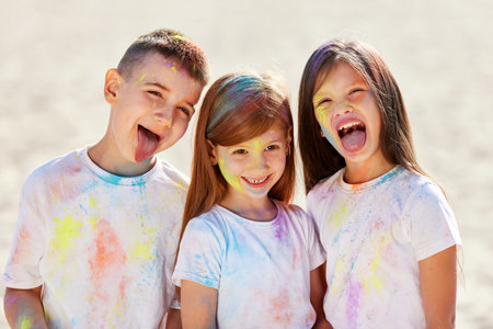 child girls and boy celebrate Indian holi festivalの写真素材