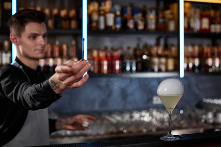 barman is making cocktail with smoky air bubbleの写真素材