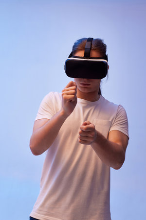 Young man using virtual reality headset. VR gadgetsの写真素材