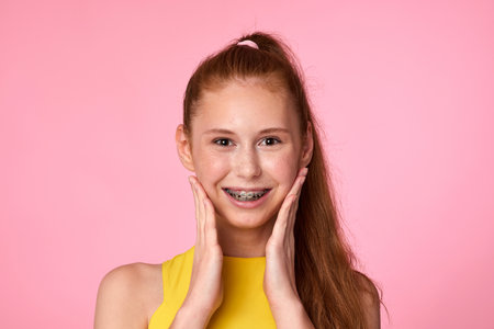 surprised teenager girl on green background. Human emotionsの写真素材