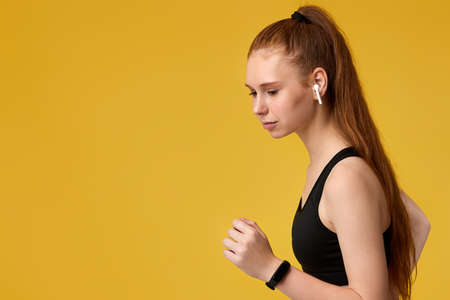 girl listening to smartphone music wearing earphones