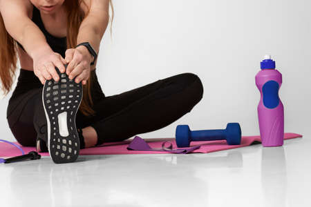 Strong sporty girl in black sportswear working outの写真素材