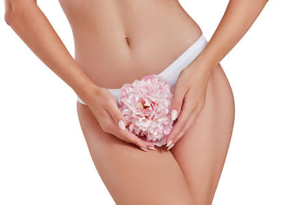 female body with smooth soft skin with pink flower.