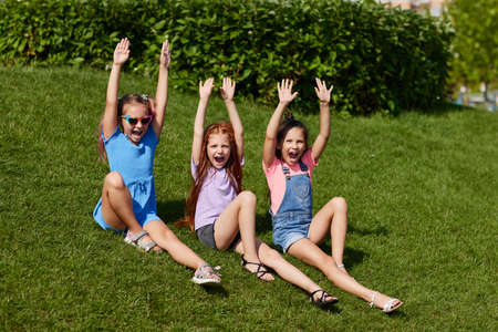 cute children girls playing together in the park