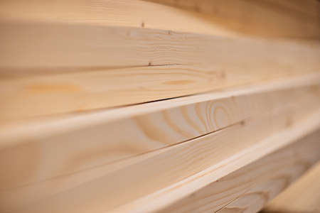 Lumber from boards in warehouse or in store for construction.
