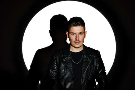 man in red leather jacket looking at the cameraの写真素材