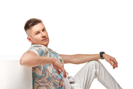 handsome young man in shirt looking at camera