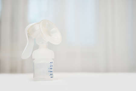 manual breast pump with empty baby bottleの写真素材