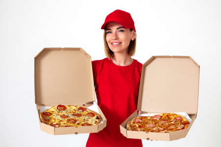 pizza delivery girl showing pizza inside boxesの写真素材