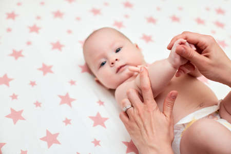 massage of baby hand by mother, Close-upの写真素材
