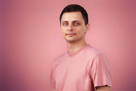 handsome man in t-shirt looking at the cameraの写真素材