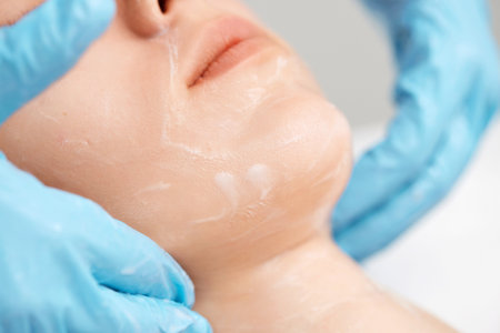 young beautiful woman receiving facial massage. spaの写真素材