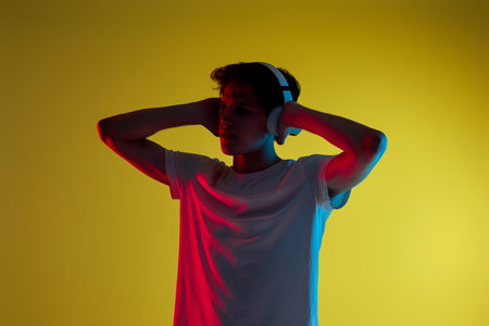 Young man listening to music with headphonesの写真素材