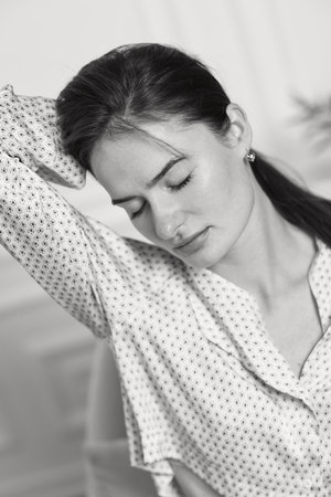 brunette woman in pajamas. black and whiteの写真素材