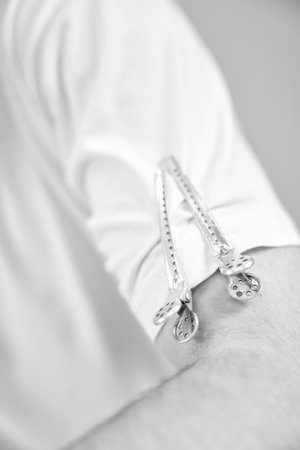 hair clips on the sleeve of a barbers T-shirtの写真素材