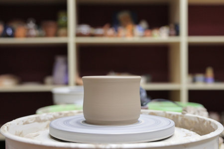 ceramic cup on on pottery wheel, Close upの写真素材