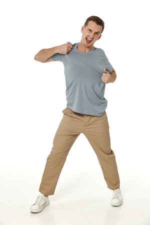 annoyed angry man shouting on white studio backgroundの写真素材