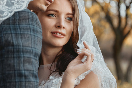 happy bride and groom enjoying romantic moments outsideの写真素材