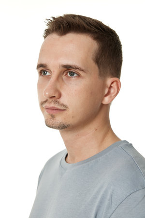 handsome young calm man on white backgroundの写真素材