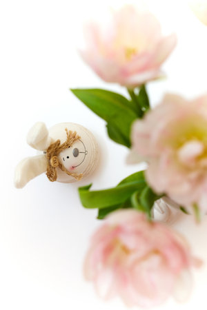 bouquet of tulips and Easter bunny on white table. copy spaceの写真素材