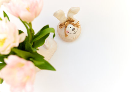 bouquet of tulips and Easter bunny on white table. copy spaceの写真素材