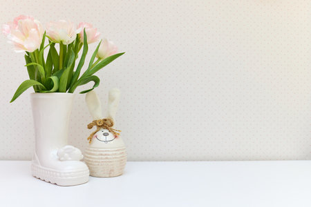 bouquet of tulips and Easter bunny on white table. copy spaceの写真素材