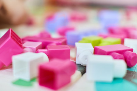 colorful plastic building toy blocks on the floorの写真素材