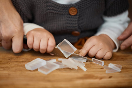 close-up, mother helps her little child girl for preparing hand-made soap, art workshops for...