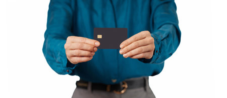 female hand holding black premium credit bank card on white background. digital business finance and...