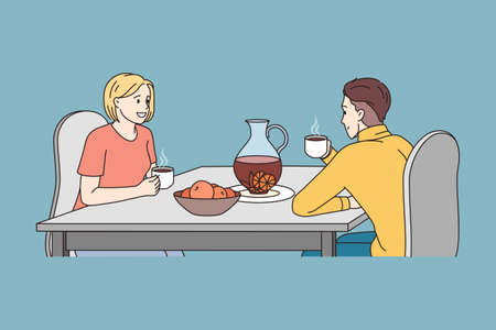 A man and a woman are talking at a table in a restaurant. vector illustrationのイラスト素材