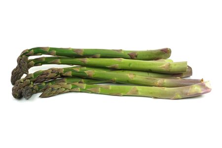 Fresh green and violet asparagus isolaed on white.の写真素材