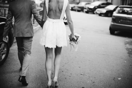 Bride in extremely short and sexy dress with open back.の写真素材