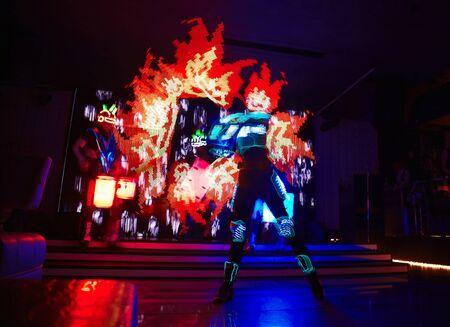 Laser show performance with flames and glowing drums, very beautiful night club performance, partyのeditorial素材