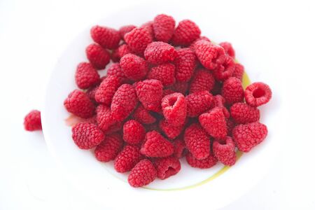 Fresh raspberry on white plate