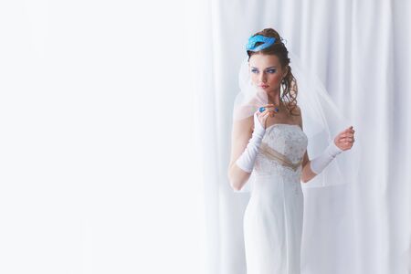 Bride in original MUAH with carnival maskの写真素材