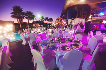 Luxury wedding decorated round tablesのeditorial素材