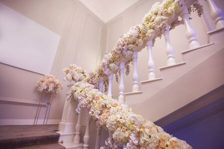 Decorated with flowers ladder for ceremonyの写真素材