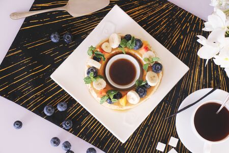 Coffee mousse served with fruits and berries