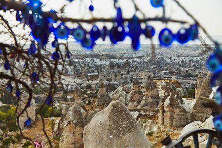 Tree with amulets on hill with Cappadocia view in Turkeyの写真素材