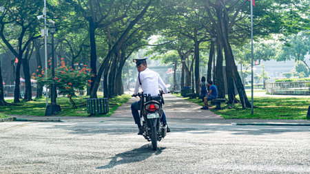 Rizal  Park, Manila, Philippines July 2, 2014: One of the roving guards at Rizal Park along Taft Ave., Manila, Philippinesのeditorial素材