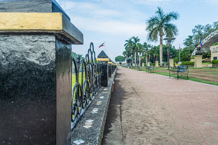 Rizal Park, Manila, Philippines July 2, 2014: The benches along the path around the water fountain at the Rizal Park in Manila, Philippinesのeditorial素材