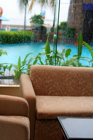 sofa near by poolの写真素材