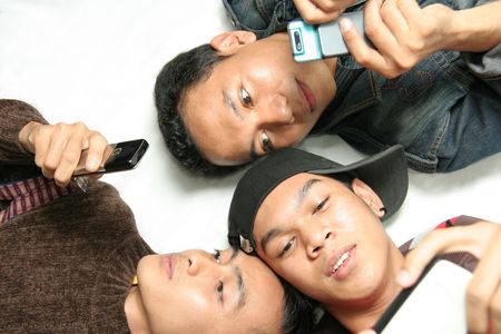three man with mobile deviceの写真素材