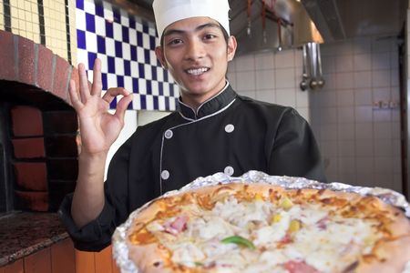 chef with pizzaの写真素材