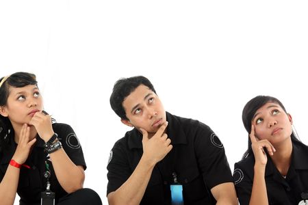 staff in uniform looking at copy space aboveの写真素材