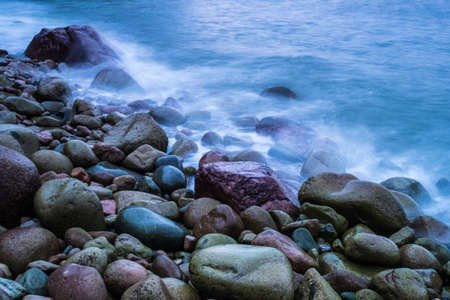 Cobblestone sea waterの写真素材