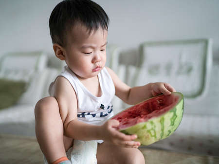 boy eating watermelonの写真素材